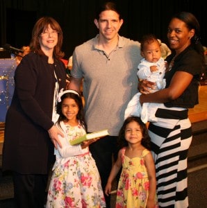 Ellie Debb (holding siddur) and family with Zena Herod, Head of School