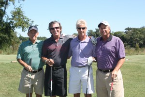Team players Alvin Wall, Steve Sandler, Ed Reed, and Ron Kramer