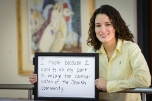 Jen Groves, vice-chair of the 2013 Super Sunday Committee, launches the first in a series of community photos and statements: “I invest because...” (photo by Laine M. Rutherford)