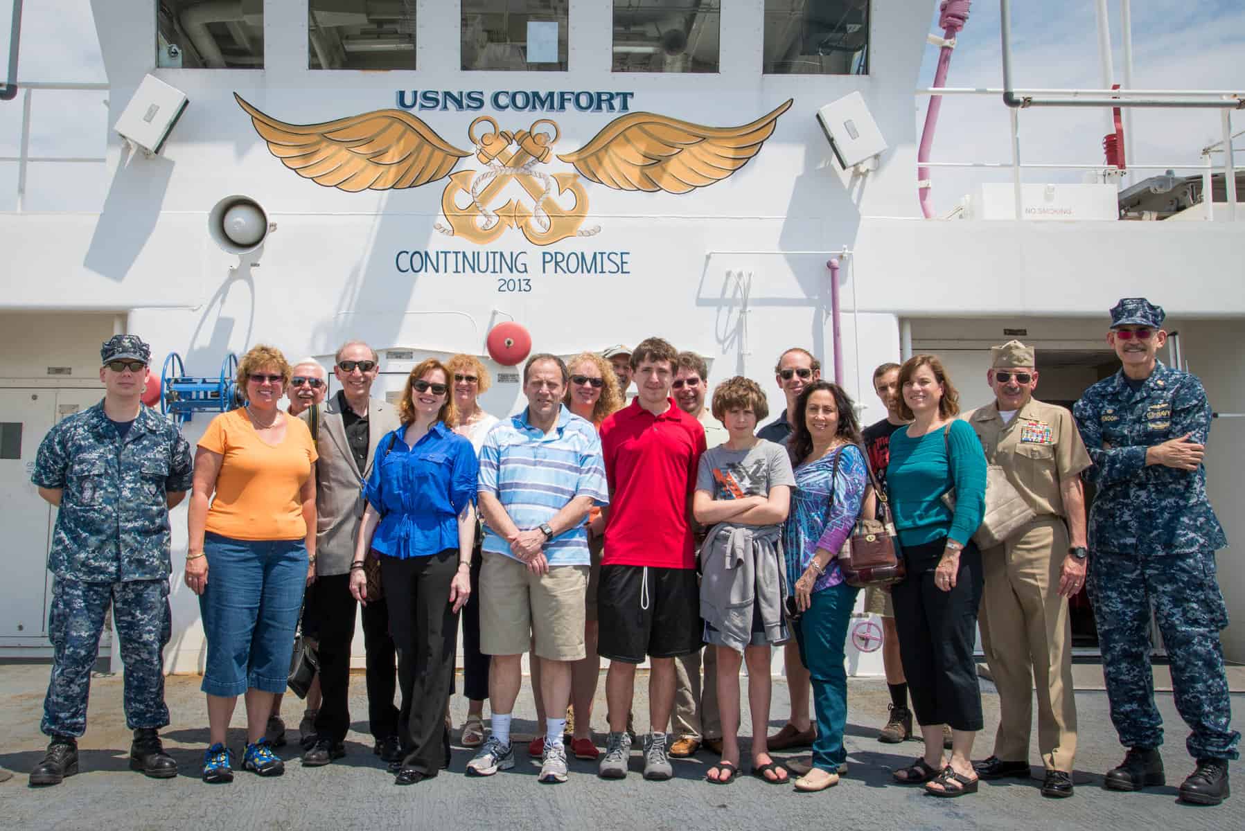 UJFT visitors stand on the upper deck of the USNS Comfort.