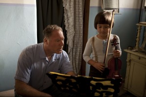 Director Josh Aronson instructs Henk Reinicke as little Broni Huberman in Orchestra of Exiles, a film by Josh Aronson. A first Run Features release. Photo by Irina Trübbecke.