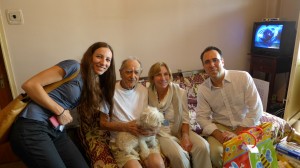Zoya Shvartzman, Annie Sandler and Doron Goldstein, make a home visit (to the man in the center) in Bucharest.