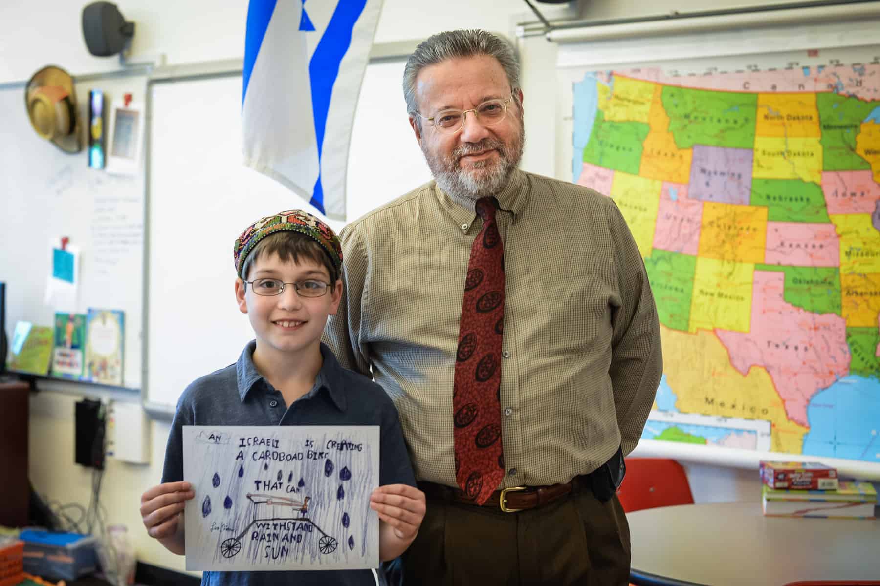 Leo Kamer, 2014 Poster Contest winner, with Harry Graber, UJFT executive vice president.