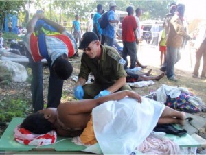 Lt. Col. Dr. Ofer Merin attending to patients in Haiti following the devastating earthquake in Haiti in 2010.