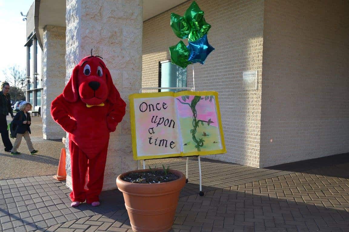 Clifford, the Big Red Dog, greets students at the Book Fair in Oscars red-carpet style