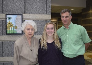 Dana Cohen, Holocaust survivor, with Lynnhaven Middle School artist Corinna Ensley and her father Pat Ensley.
