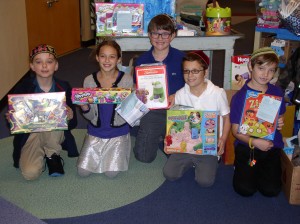 Hebrew Academy Student Government Association officers pose with donated gifts from Hebrew Academy and Strelitz Early Childhood Education Center.