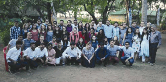 American and Indian groups before Shabbat