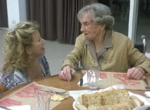 Mission Participant Honey Maizel chats with Marguerite during dinner. In her late-90’s Marguerite had been a young nurse in the early part of WWII. She came to Argentina after her native Belgium was liberated.
