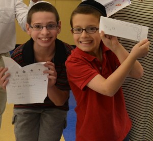 Ofek Newman and Shalom Brashevitzky, HAT fifth graders, after reading letters from their pen pals from Amirim School in Kiryat Yam.