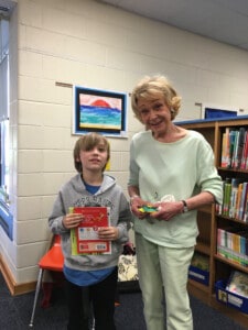 Nancy Brickell (right) receives gift from a BEAR student at Birdneck Elementary.