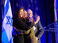 Virginia native and Lone Soldier Ilana surprises her parents, Marcy and Michael Mostofsky, on stage during the FIDF Virginia Inaugural Gala.