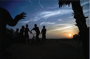Photo by Annie Sandler Arab Israeli youth play at sunset in a Bedouin village.