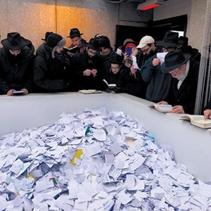 Praying at the Rebbe’s resting place alongside others of the thousands that visited that day.