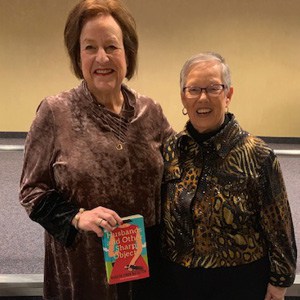 Author Marilyn Simon Rothstein and Sherry Lieberman, JCC Book Club organizer, with Book Club Cake by Custom Cake Shoppe.