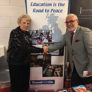 Joy Wolfe welcomes a Palestinian visitor to the StandWithUs UK stand at the 2017 International Shalom Festival held in Scotland during the Edinburgh Festival.