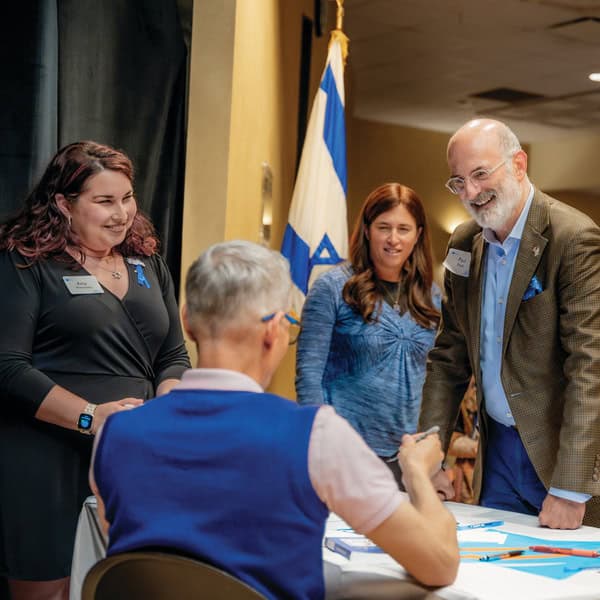 Amy Weinstein, speaker Joel Chasnoff, Sara Litt, and Paul Peck.