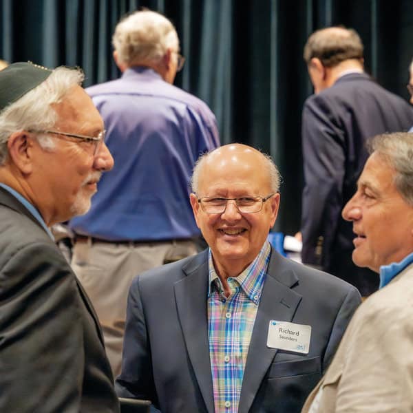 Rabbi Michael Panitz, Richard Saunders, and Herm Shelanski.