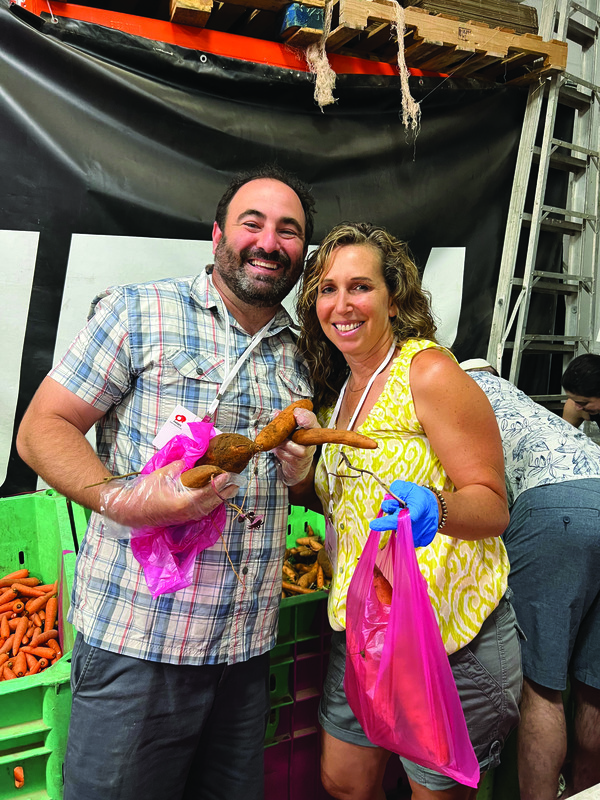 Craig and Joanna Schranz packing food in Israel.