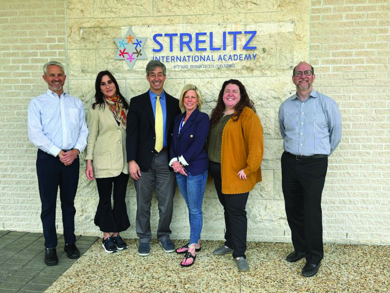 Heather Moore, Strelitz International Academy’s head of school (fourth from left), with the accreditation team after successfully renewing SIA/s accreditation status.