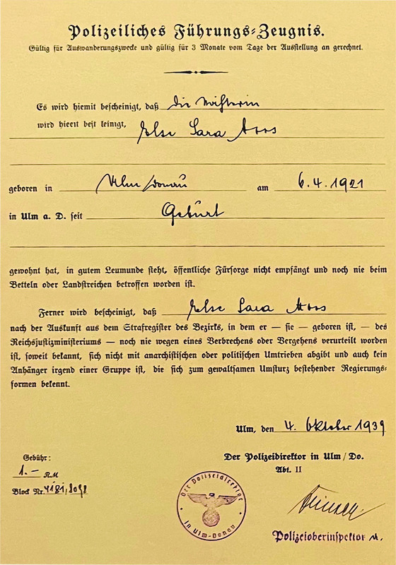 Vanessa Freihofer’s grandmother, Elsie Hirsch in Ulm (maiden name Elsie Moos) along with her police clearance certificate. The certificate says Elsa Sara Moos. The Nazis forced all female Jews to carry the middle name Sara. Later, after the war, they revised documents and birth certificates to exclude Sara.