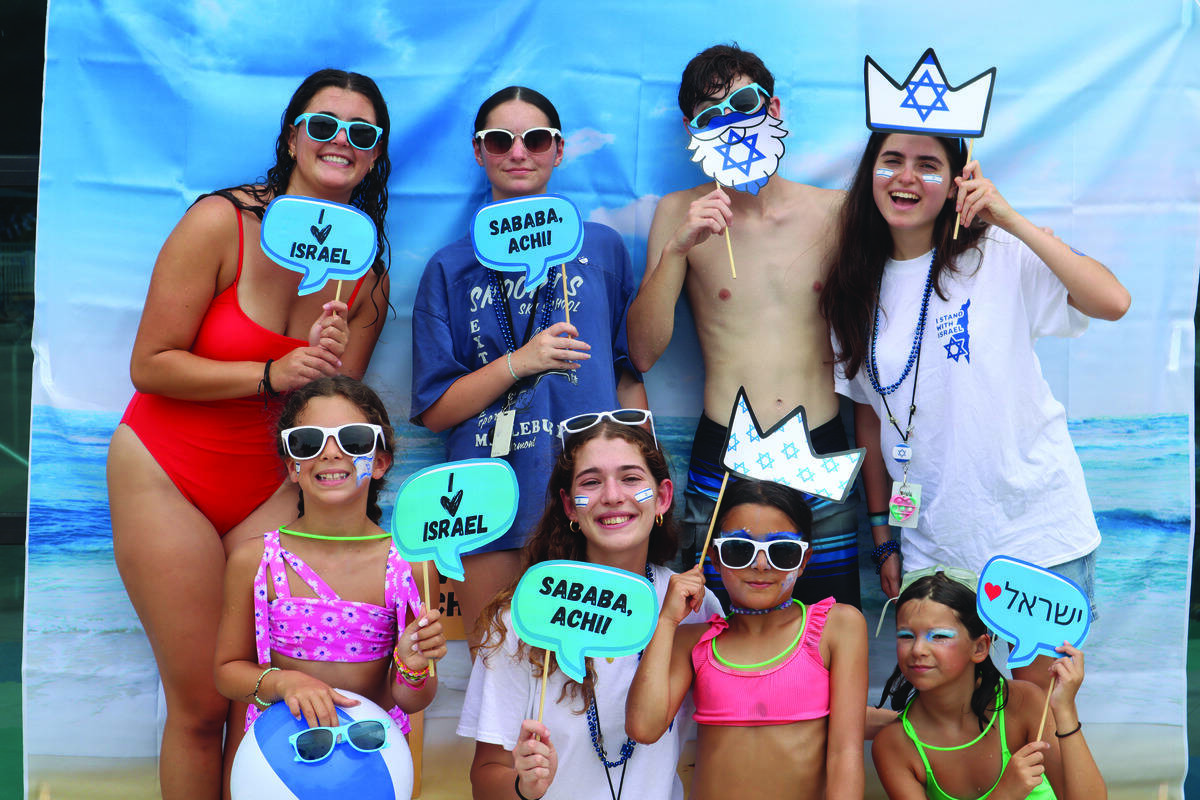 Israeli Pool Party Photo Booth. Bottom Ella Gladstein, Naomi Friedland (shinshin), Mia Pinto, and Madeline Kramer. Top Silver Lerner (counselor), Jocelyne Bobrowitz (counselor), Jordan Cubitt (counselor), and Maya Ostrov (shinshin).