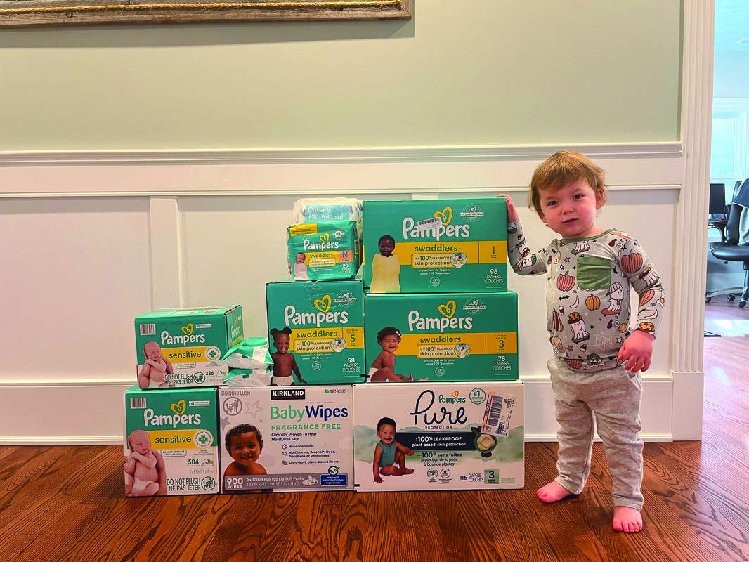 Asher Gross with diapers to be donated to Jewish Family Service.