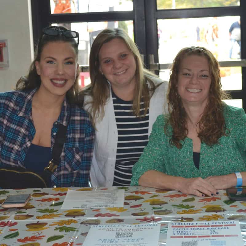 Teachers help with check in.