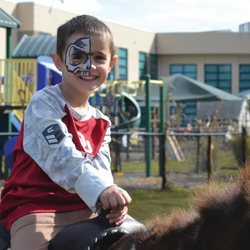 Rocky Ferraro rides the pony.