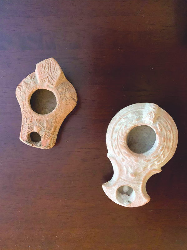 Roman-era mold-produced lamps (about 1st century of the Common Era), from the collection of Sheila and Rabbi Michael Panitz.