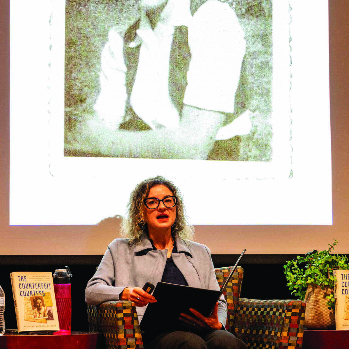 Joanna Sliwa below a photograph of Dr. Josephine Janina Mehlberg.