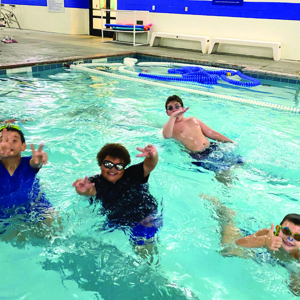 Levi Cohen, Henry Rhone III, Noah Bernstein, and Jan Hodicky always enjoy swimming at Kids Night Out.