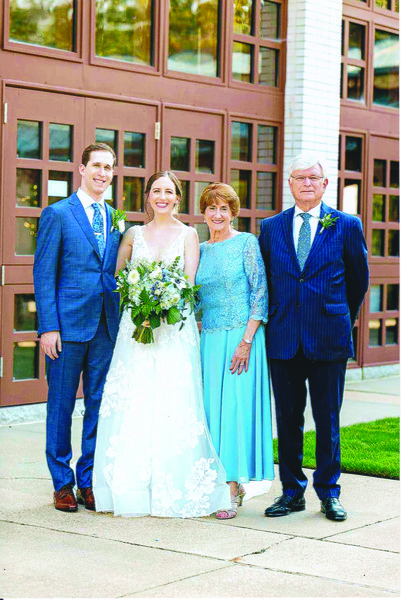 Linda and Jonathan Longman with their granddaughter Sara and her husband, Jonathan, on their wedding day in 2022