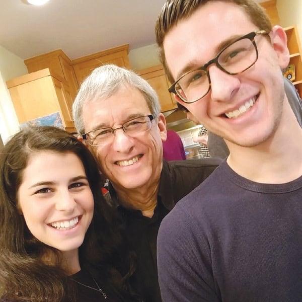 Cantor Elihu Flax (center) with his children, Arielle and Solomon.