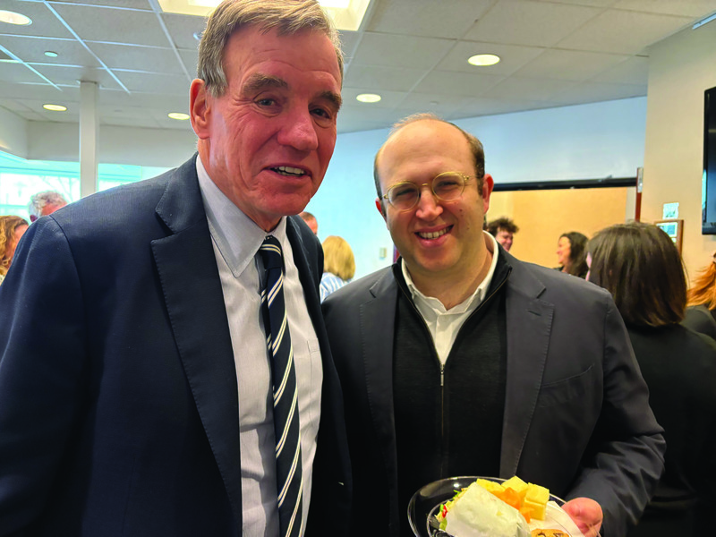Senator Mark Warner and Aron Slone.