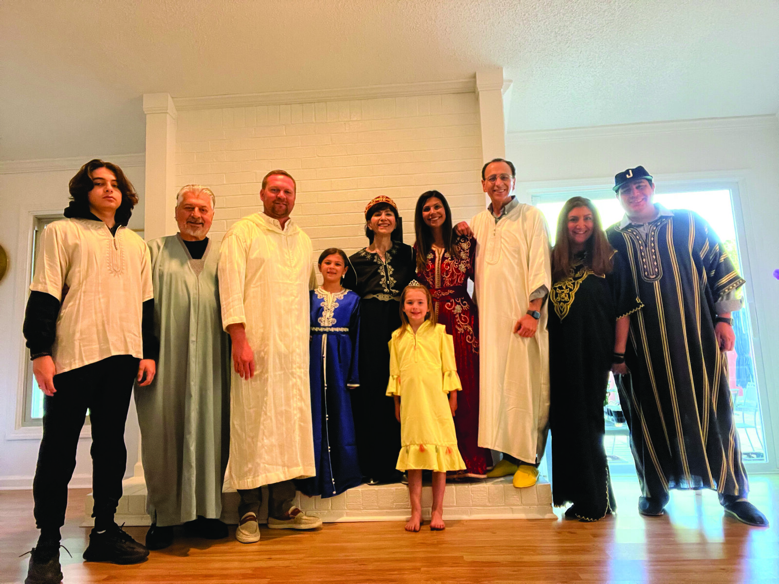 Aaron and Maurice Levy, Matt and Bellamy Baldwin, Dinah Halioua, Gabrielle Baldwin, Raphaël Halioua, Rebecca and Nessim Halioua, and Cora Baldwin in the center at Pesach 2022.