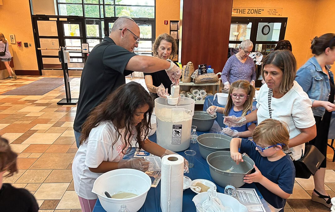 Community Challah Bake for JFS holiday gift bags rises to annual event stature