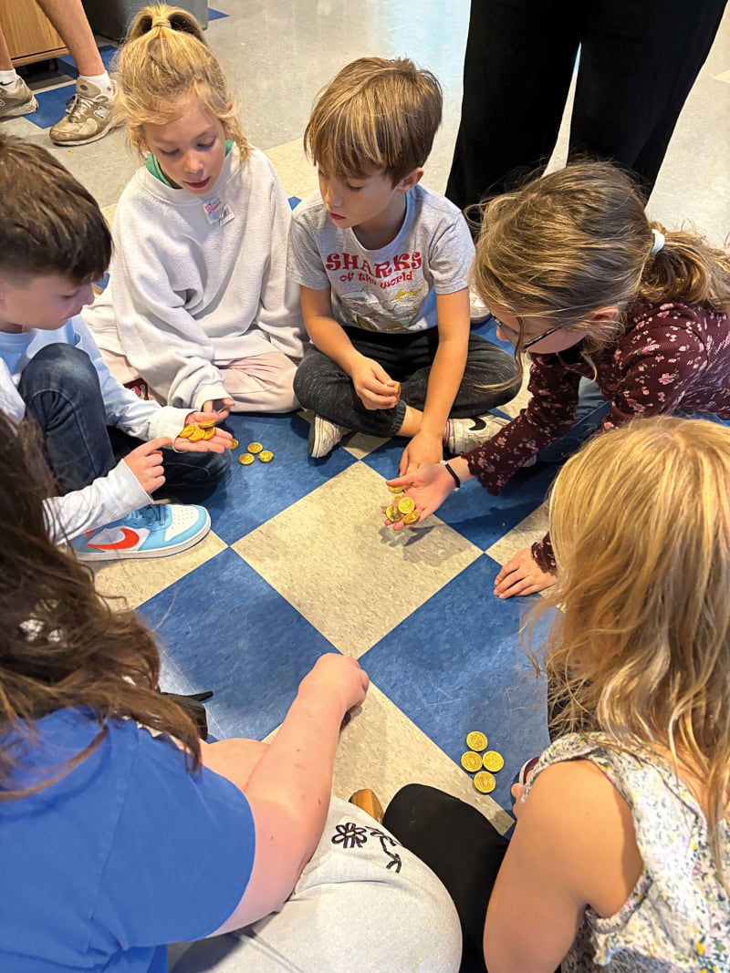 As winter break fell during Hanukkah last year, campers got to enjoy a dreidel competition with chocolate coins at stake. Killian Bickerton, Izzy Ford, Simon Fine, and Lily Bertani.