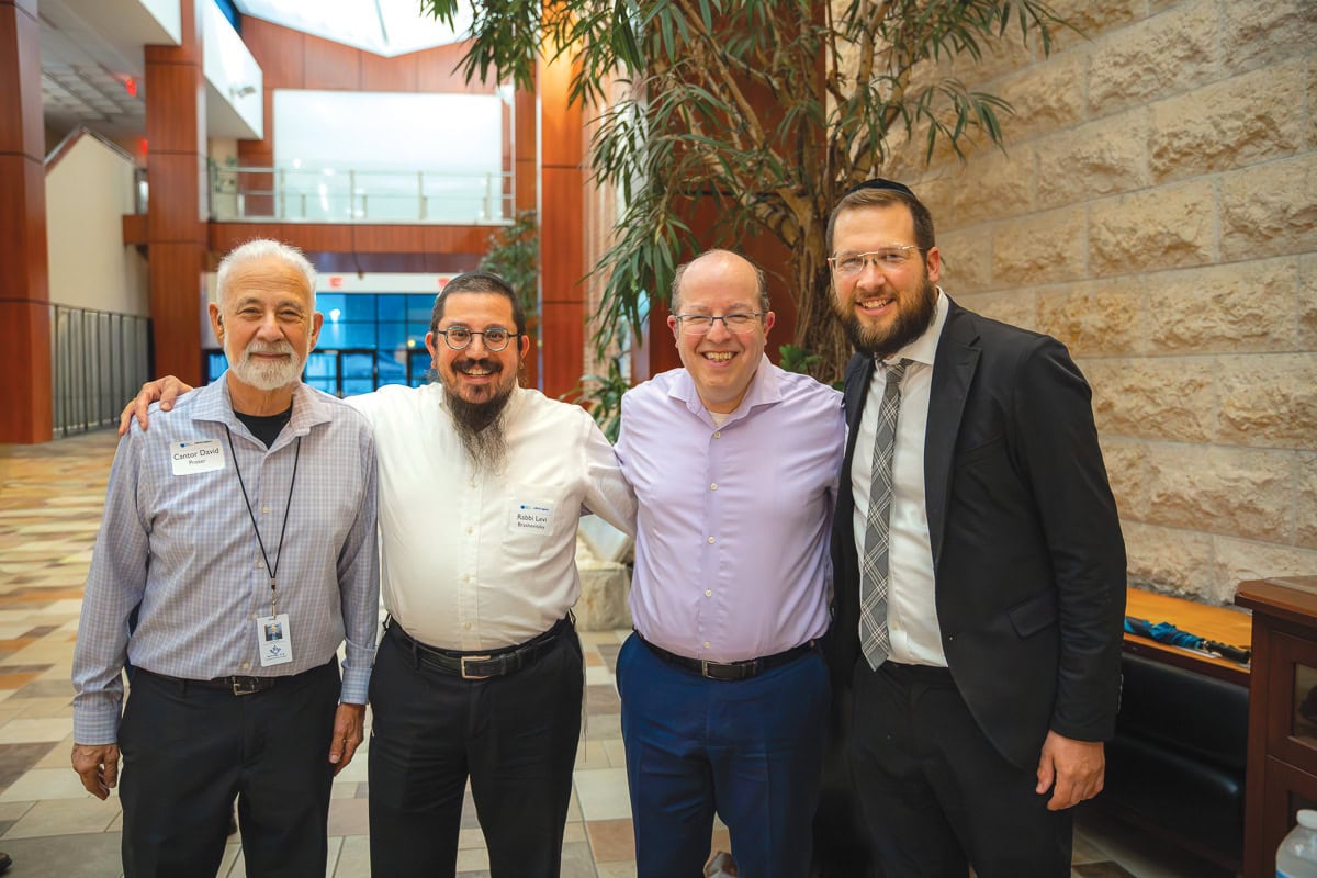 Cantor David Proser, Rabbi Levi Brashevitsky, Rabbi Daniel Cohen, and Rabbi Shlomo Eisenberg.