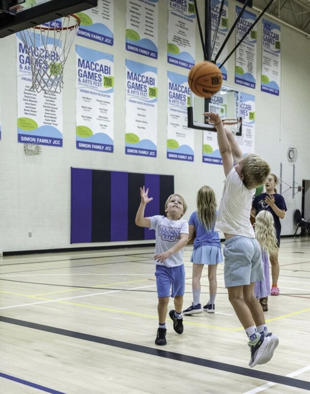 Noah Bowers plays basketball with younger brother, Bennett Bowers.