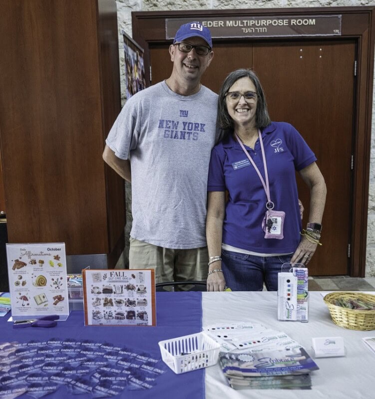 Chris and Michelle Fenley at Jewish Family Service table.