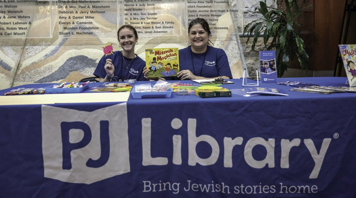 PJ Library table with Kyleigh Eyl and Sarah Cooper.