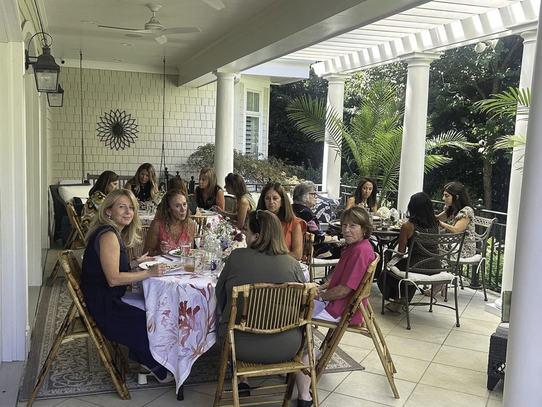 Women enjoy lunch on Jodi Klebanoff’s terrace.
