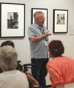Docent Harry Graber explains the context of one of Ilse Bing’s photographs.