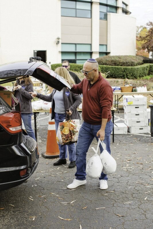 Rabbi Ari loads Thanksgiving groceies in 2025.